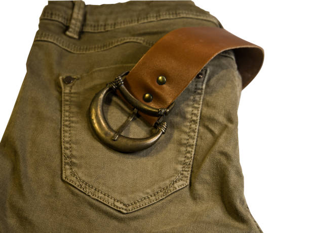 istock folded khaki jeans with brown belt isolated 2199567566