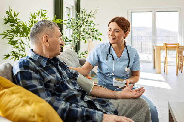istock Nurse Taking Blood Pressure of Elderly Patient 2199568702