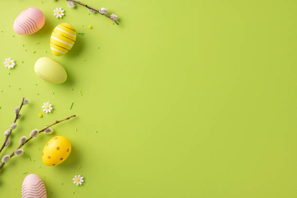 istock Easter-themed arrangement with colorful eggs, blossom branches, and fresh green background. Perfect for celebrating springtime and Easter festivities 2199569550