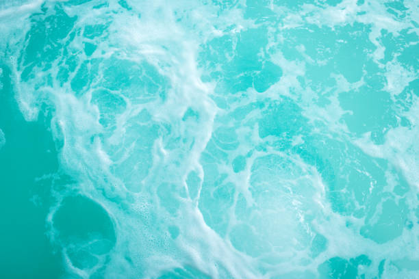 A Detailed View of a Hot Tub With Swirling, Warm Water, Set Against a Calming Water Background. The Inviting Bubbles and Steam Enhance the Atmosphere of Tranquility, Making It a Great Choice for Wellness Resorts, Hotels, and Relaxation-focused Advertisements.