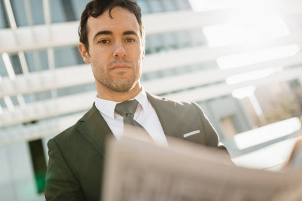 istock caucasian business man portrait with newspaper 2199571182