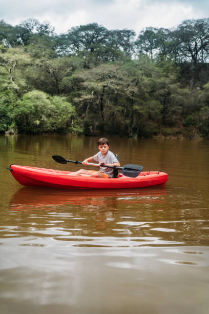 istock Boys paddling Kayak in lake 2199571427