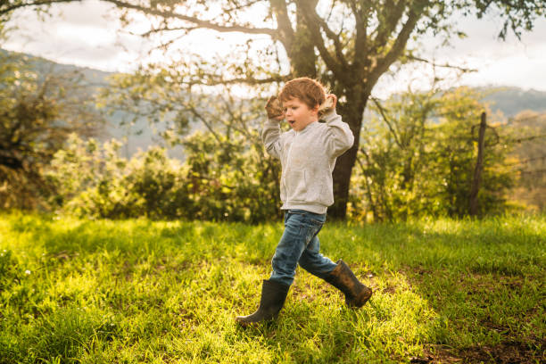 istock Kids playing in the nature 2199571460