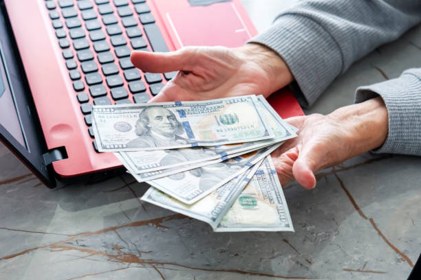 istock Saving money - buying gold  bar 2199577326