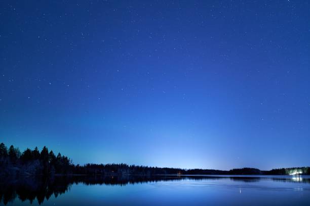 istock Starry Night Sky Over Calm Lake 2199577805