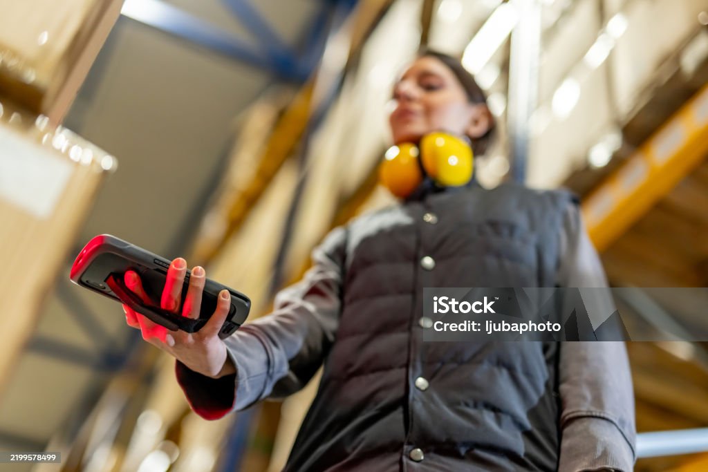 Warehouse Scanner Operator Warehouse Worker Operating Barcode Scanner In An Industrial Storage ...
