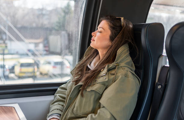 istock Woman sleeping in public transport 2199582487