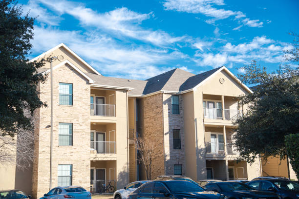 istock Busy outdoor parking at student housing multistory college apartment complex under sunny winter cloud blue sky in Dallas, Texas, on-campus housing dormitory residence hall education graduate 2199582503
