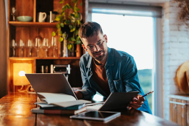 istock Caucasian businessman working at home. 2199582702
