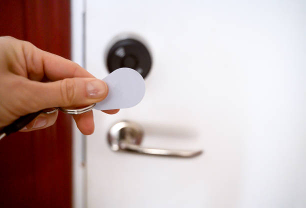 A blue RFID (Radio Frequency Identification) keychain receiver on a white background. A technology that uses radio waves to wirelessly identify objects, animals, or people. Used by electronics, mechatronics, and networking engineers.