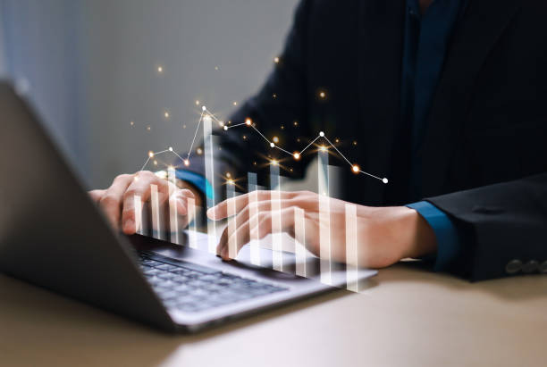 istock Businessman Growth Chart and Rise of Virtual Graph. Growth graph and financial data analysis for strategic business planning and investment progress. 2199586276