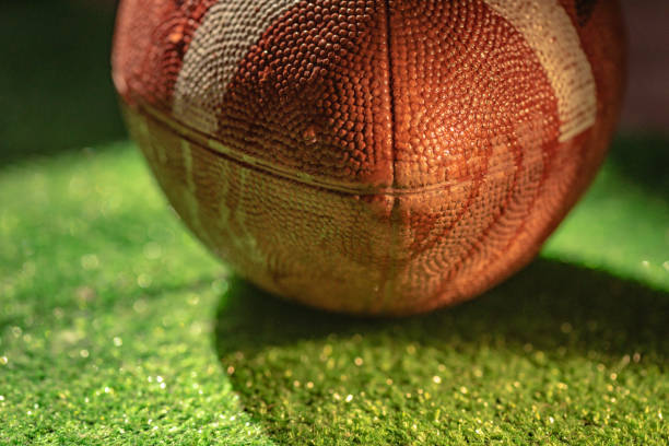 istock American football ball texture as background 2199593037