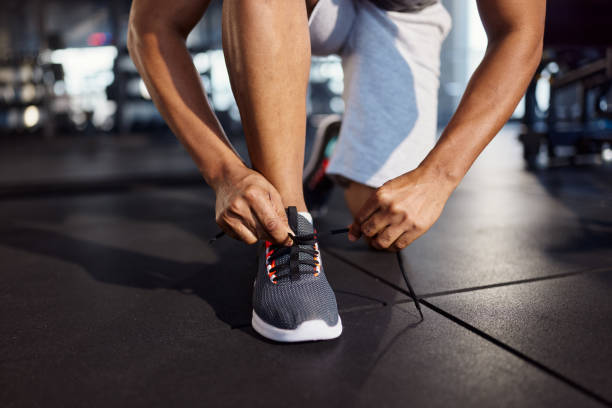 istock Tying shoelaces before sports training! 2199598811