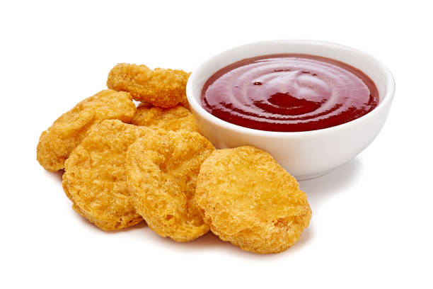 istock Tasty chicken nuggets with ketchup isolated on white 2199601292
