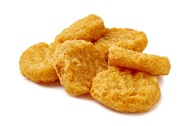istock Pile of fried chicken nuggets on white background 2199601494
