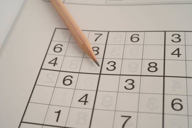 istock Sudoku puzzle, game to play for keep you brain younger for developing Alzheimer disease in senior patient. 2199603387
