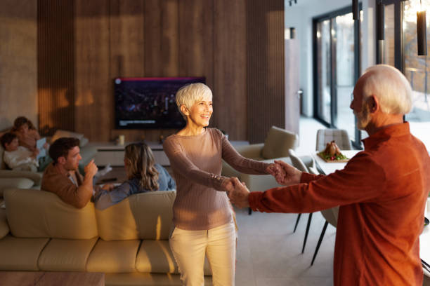 istock Happy senior couple dancing at home. 2199605947