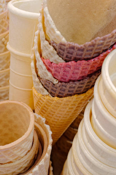 Lots of stacked empty ice cream cones, close up shot, abstract food background
