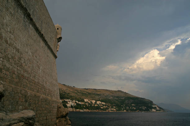 Narrow street of the old town of Dubrovnik. Picturesque view on the old town (medieval Ragusa), Dalmatian Coast of Adriatic Sea. World Heritage Sites UNESCO