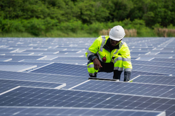 istock Engineer checking solar panels on a floating buoy. The power plant uses water and renewable energy to produce eco-friendly electricity. 2199611313
