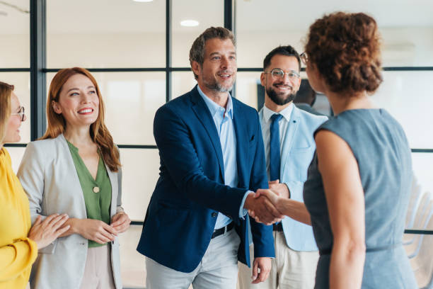 istock Business people shaking hands in the office 2199612724