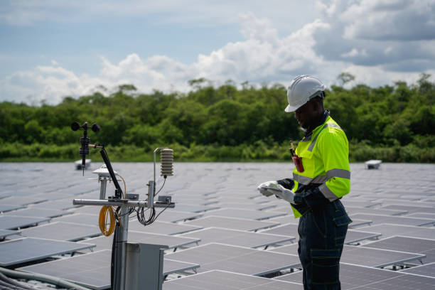 istock Engineer checking solar panels on a floating buoy. The power plant uses water and renewable energy to produce eco-friendly electricity. 2199612941