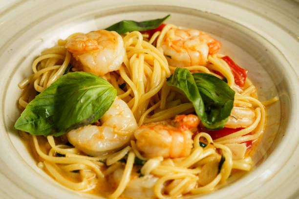 Shrimp pasta with fresh basil and cherry tomatoes