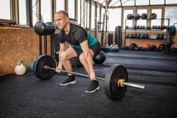 istock Dedicated athlete practicing deadlifts in a modern gym setting for strength training and fitness improvement 2199615986