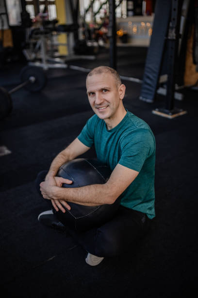 istock Dedicated athlete practicing strength training at a modern gym while focusing on health and wellness 2199616025