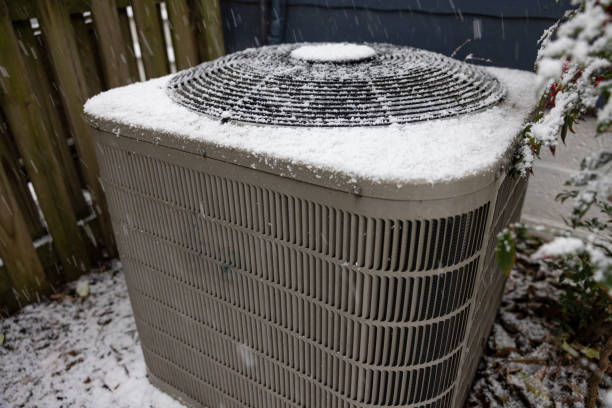 istock Heat and Air Conditioning Compressor in a Light Snow 2199617657