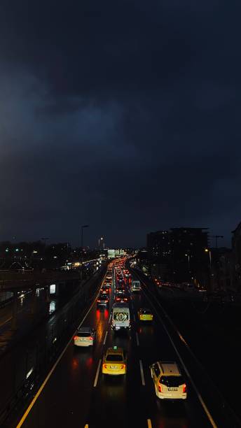 istock Nighttime Traffic in Istanbul: Red Lights Reflected on Wet Roads 2199621128