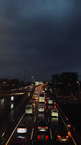 istock Nighttime Traffic in Istanbul: Red Lights Reflected on Wet Roads 2199621129