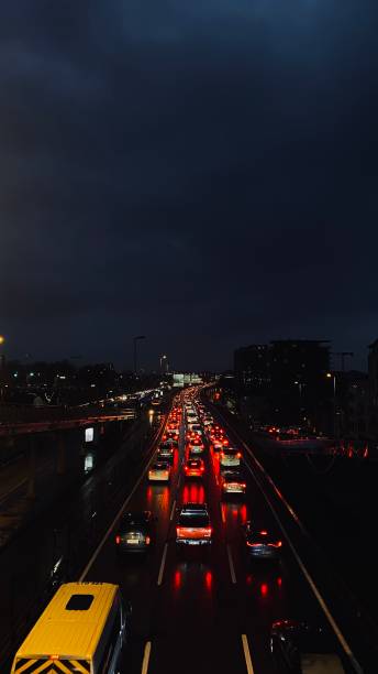 istock Nighttime Traffic in Istanbul: Red Lights Reflected on Wet Roads 2199621134