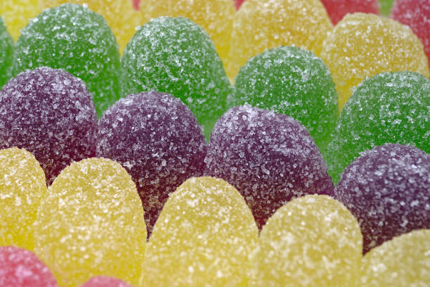 A lot of colorful gumdrops. Close up shot, abstract food background.