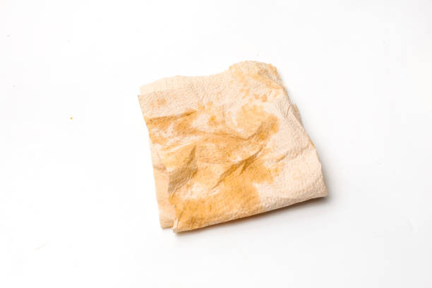 oil stains on kitchen tissue isolated on white background