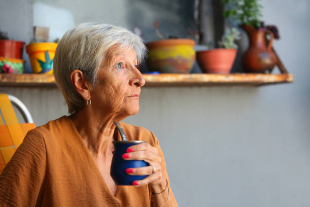 istock senior woman enjoying Yerba Mate at her backyard relaxing 2199623679