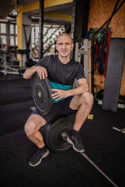 istock Focusing on strength training in a gym setting promotes a healthy, active lifestyle and personal improvement for aspiring athletes 2199624579