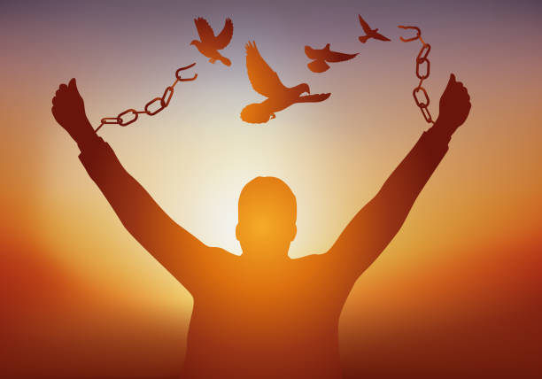 ilustrações de stock, clip art, desenhos animados e ícones de a man frees himself by breaking his chains while watching doves fly away. - liberdade
