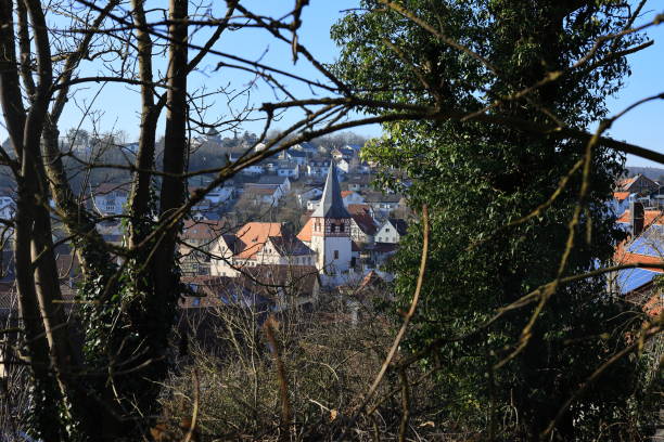 istock Church in Flacht photographed through a hedge 2199625268