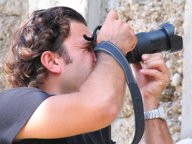 Young turist taking picture in the city