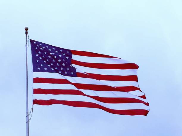 istock Red white and blue American flag in the sky 2199626893