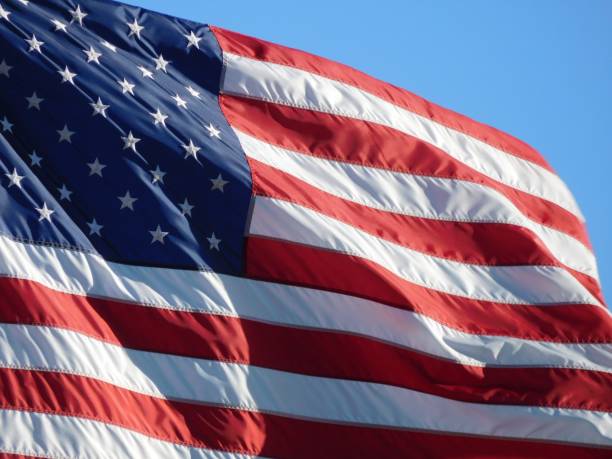 istock Red white and blue American flag in the sky 2199626931