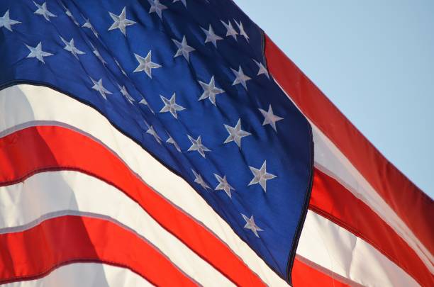 istock Red white and blue American flag in the sky 2199626942