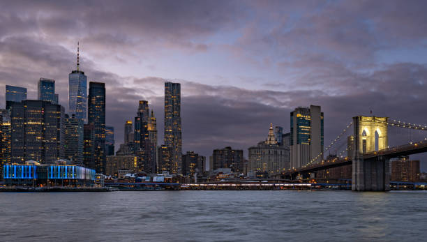 istock Vibrant Sunset Over The Brooklyn Bridge and Downtown Manhattan Skyline as Seen from the DUMBO Area of Brooklyn New York City USAVi 2199632049