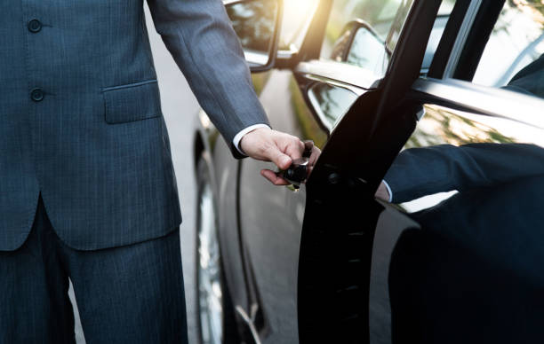 istock Well dressed man opening a car door 2199640317