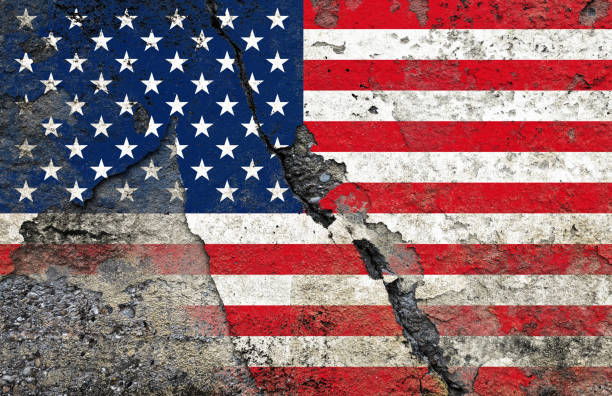 istock American Flag on Cracked and weathered wall - Symbolizing Internal Conflicts and Societal Fractures of the United States 2199641325