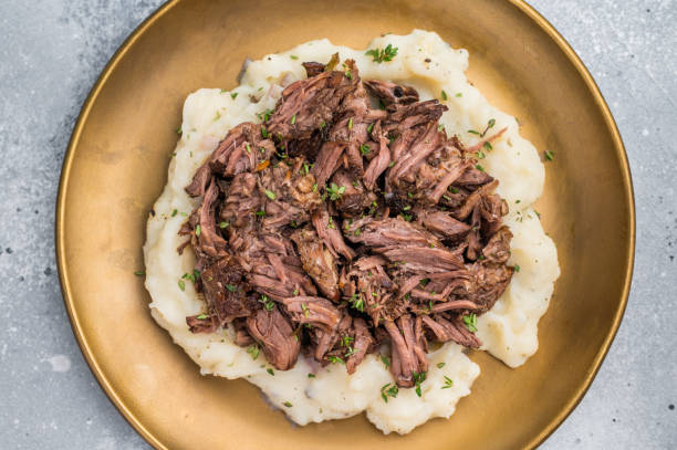 istock Homemade French Beef Bourguignon Stew on a plate with mashed potatoes. grey background. top view 2199641660