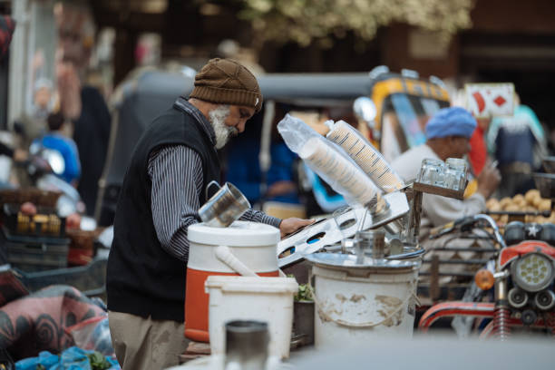 Giza, Egypt - January 23, 2025: Day at the local groceries market on the streets of Giza, famous for historic landmarks - Giza Pyramids. Local sellers waiting for the customers