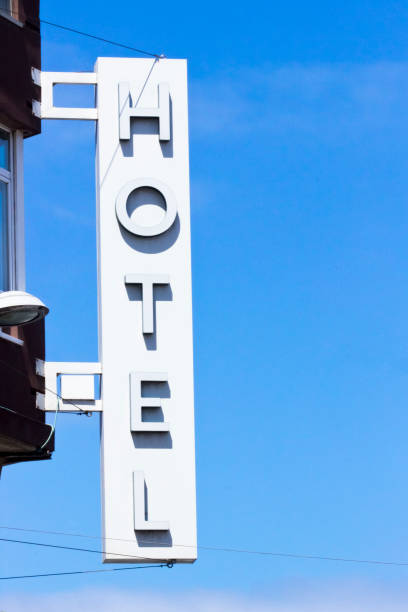 istock Hotel sign in the sunlight, clear blue sky background. 2199646994