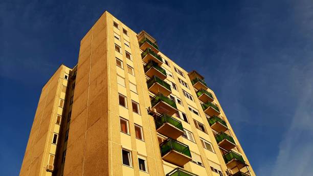 istock Urban glow: sunlit ten-story apartment block 2199647281